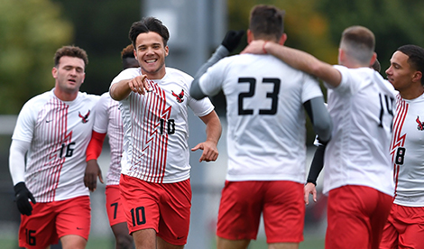 Tamas celebrates in soccer match by pointing at teammates